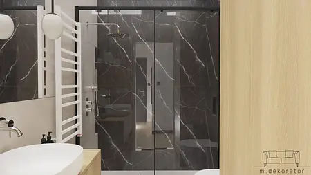 Nowoczesna łazienka z czarnymi płytkami, białą umywalką i drewnianymi elementami, minimalistyczny design.