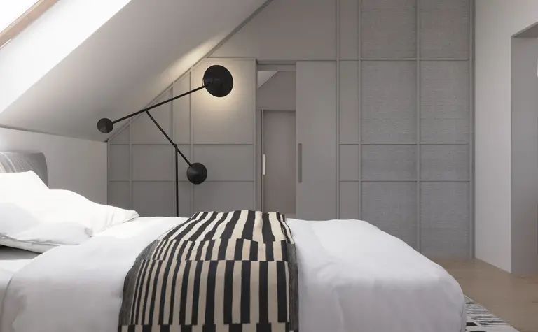 Nowoczesna sypialnia z szarymi ścianami i minimalistycznym oświetleniem w stylu dopamine decor.