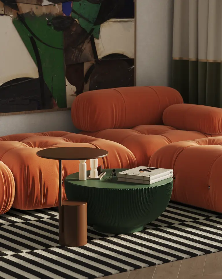Nowoczesny salon w stylu art deco z pomarańczowymi sofami i zielonym stolikiem.