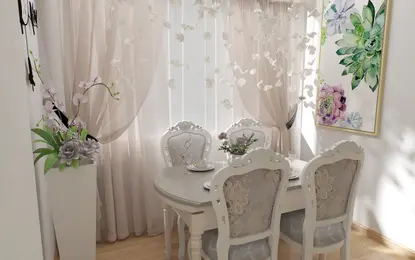 Jadalnia w stylu glamour z białym stołem, szarymi krzesłami i kwiatami.