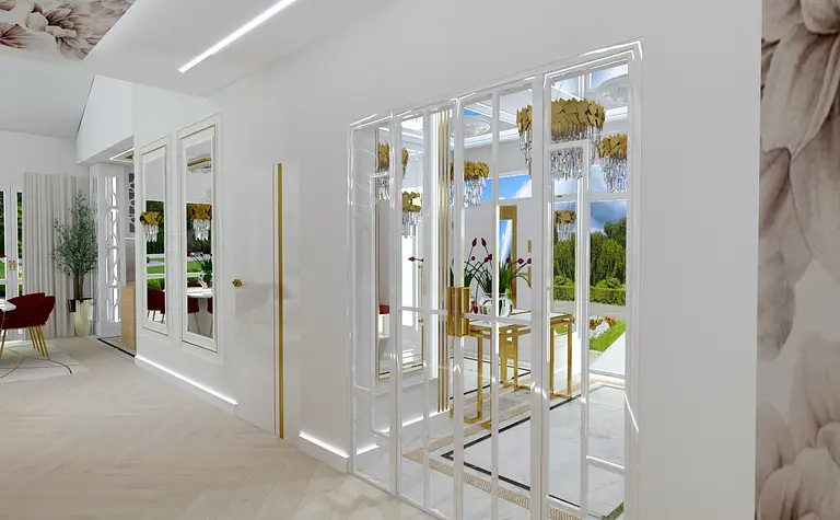 Wnętrze z białymi meblami, złotymi detalami i roślinami.