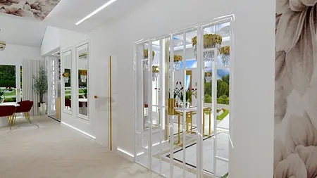 Wnętrze z białymi meblami, złotymi detalami i roślinami.