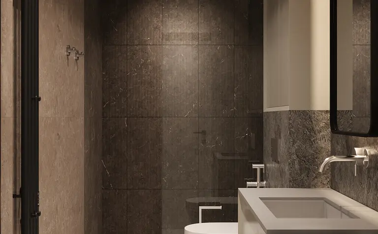 Wnętrze łazienki z minimalistycznym designem, szarymi płytkami i nowoczesnymi akcesoriami