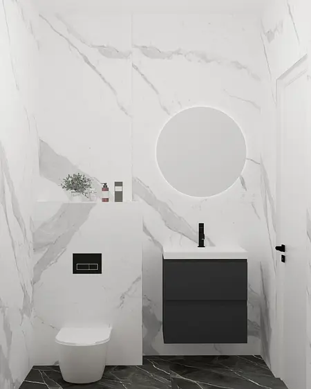 Nowoczesna łazienka z białymi płytkami, czarną umywalką i minimalistycznym designem.