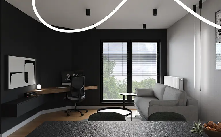 Minimalistyczne wnętrze biura z szarym biurkiem i czarną kanapą.