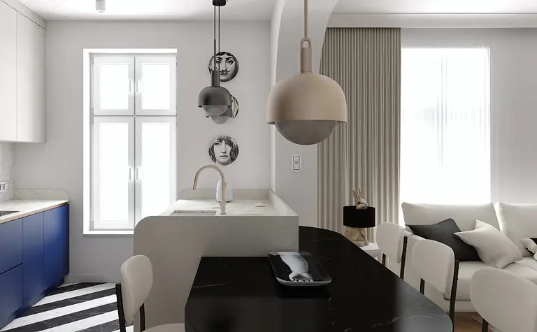 Wnętrze kuchni w stylu art deco i nowoczesnym z niebieskimi meblami i białym blatem.