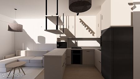 Wnętrze kuchni z minimalistycznymi i współczesnymi meblami w jasnych kolorach.