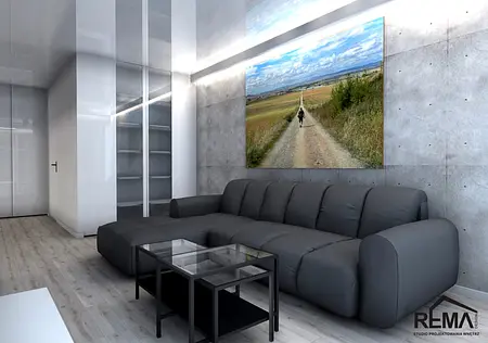 Wnętrze salonu w stylu industrialnym i minimalistycznym z szarymi ścianami i czarną sofą.