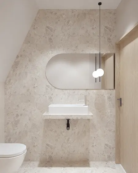 Nowoczesna łazienka z białą umywalką i drewnianymi detalami w stylu boho i minimalizmie.