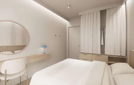 Wnętrze sypialni w stylu japandi, minimalistycznym i nowoczesnym z białymi meblami.