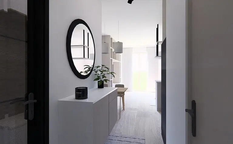 Przedpokój w stylu minimalistycznym z białymi meblami i czarnymi detalami.