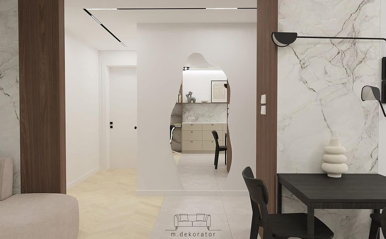 Wnętrze korytarza z minimalistycznym designem, jasne ściany i drewniane elementy.