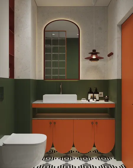 Wnętrze łazienki z pomarańczowymi detalami, industrialnymi i vintage akcentami.
