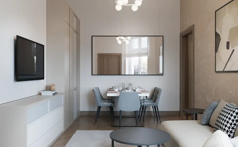 Wnętrze salonu w stylu art deco i glamour z jasnymi meblami.