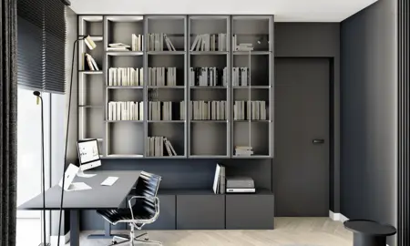 Wnętrze gabinetu w stylu minimalistycznym z nowoczesnym biurkiem i regałem na książki.