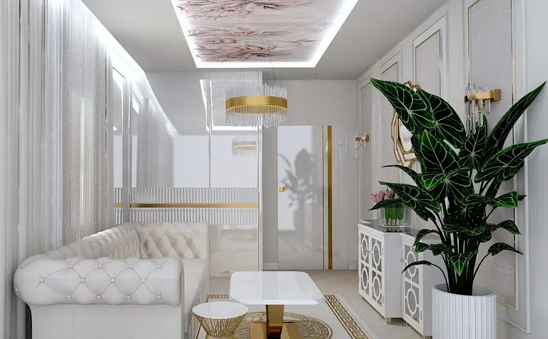 Salon w stylu glamour z białą sofą, złotymi detalami i roślinnością.