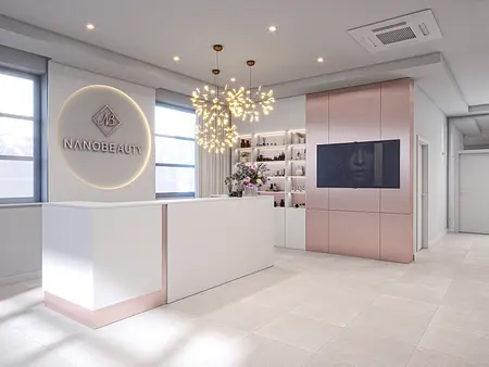 Recepcja salonu kosmetycznego z minimalistycznym designem, nowoczesnym oświetleniem i stylowymi meblami.