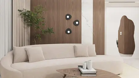 Wnętrze salonu minimalistycznego z jasną sofą i drewnianymi akcentami.