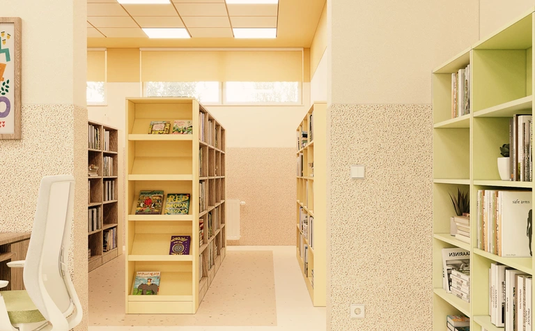 Wnętrze biblioteki z zielonymi akcentami, dopaminowym dekorowaniem i nowoczesnym stylem.