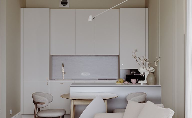Nowoczesna kuchnia w stylu soft minimalizm z białymi meblami i drewnianym stołem.