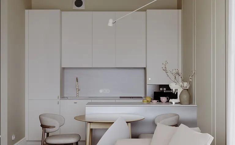 Nowoczesna kuchnia w stylu soft minimalizm z białymi meblami i drewnianym stołem.