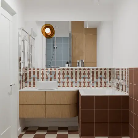 Wnętrze łazienki w stylu vintage z drewnianymi meblami i kolorowymi kaflami.