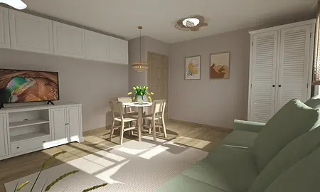 Wnętrze jadalni z drewnianym stołem, zielonymi krzesłami oraz telewizorem.