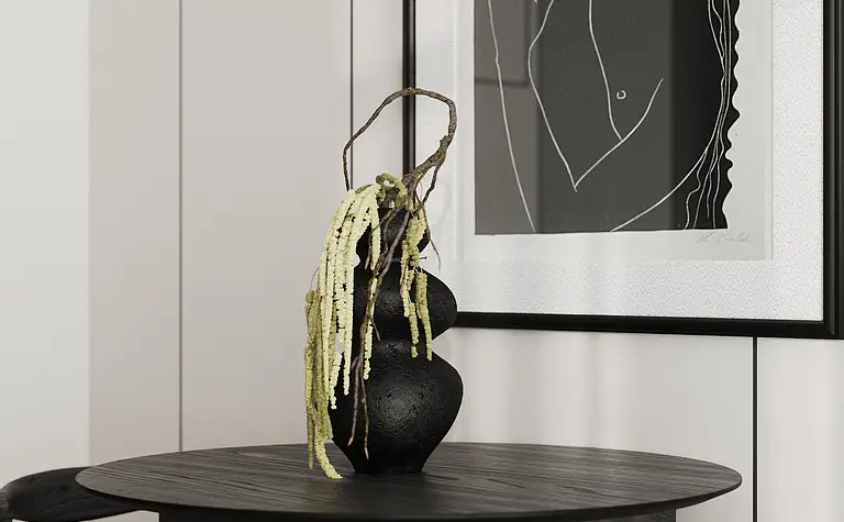 Wnętrze jadalni w stylu industrialnym i japandi z okrągłym stołem oraz czarnymi dodatkami.