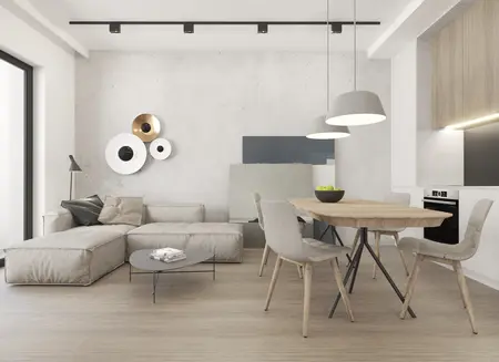 Nowoczesne wnętrze w stylu soft minimalizm z szarymi ścianami, drewnianym stołem i komfortową sofą.