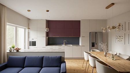 Wnętrze nowoczesnej kuchni z granatową sofą i drewnianym stołem.