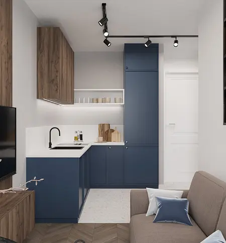 Kuchnia minimalistyczna z niebieskimi meblami i drewnianymi detalami.