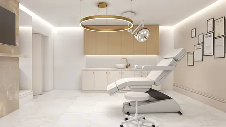 Wnętrze nowoczesnego gabinetu z białym fotelem i ceramicznymi detalami.