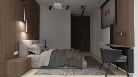 Minimalistyczna sypialnia z drewnianą ścianą i nowoczesnym biurkiem
