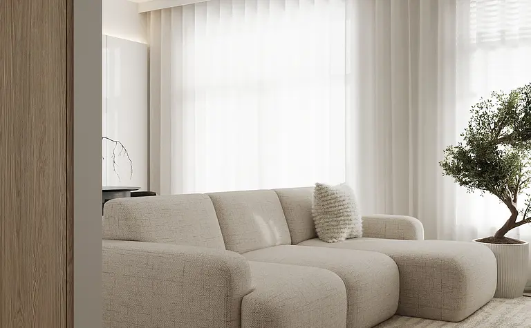 Wnętrze salonu w stylu industrialnym, japandi i minimalistycznym z jasną sofą i rośliną.