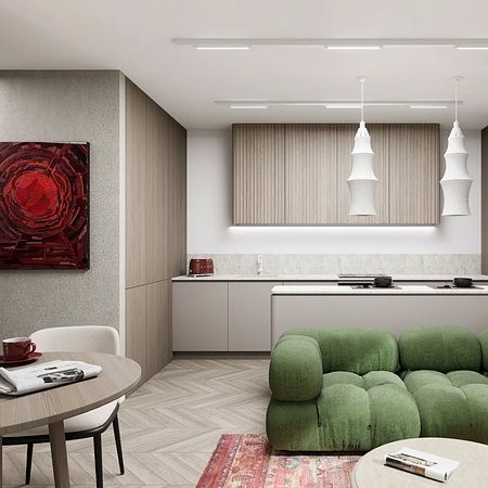 Wnętrze kuchni w stylu eklektycznym z zieloną sofą i drewnianymi meblami.