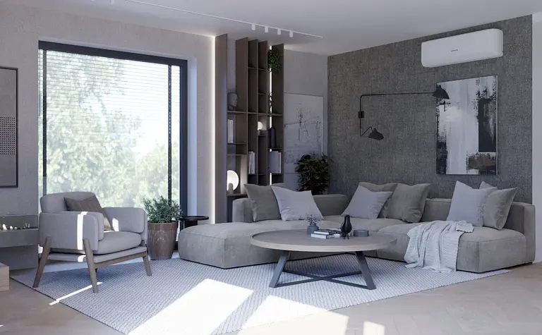 Wnętrze salonu z minimalistycznym wystrojem, szarym narożnikiem i nowoczesnymi akcentami.