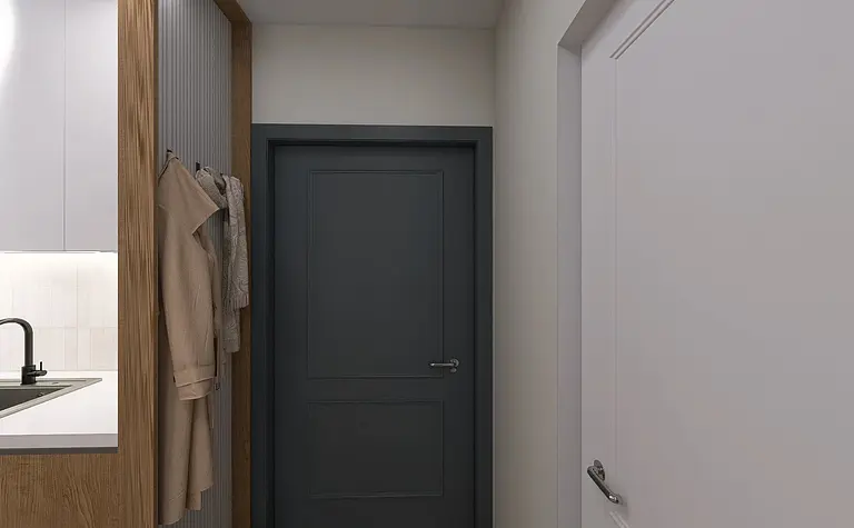 Przedpokój w stylu minimalistycznym z beżowymi akcentami i nowoczesnymi drzwiami.