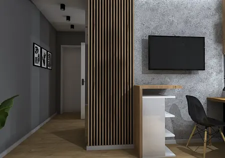 Wnętrze biura w stylu industrialnym z drewnianymi elementami i szarymi ścianami.