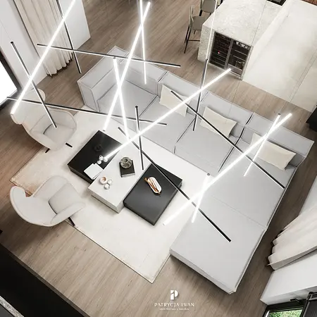 Wnętrze salonu w stylu minimalistycznym z jasnymi meblami i nowoczesnym oświetleniem.