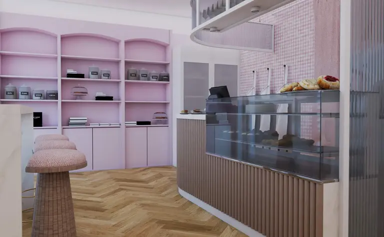Wnętrze kawiarni z różowymi ścianami, drewnianym blatem i wypiekami, styl dopamine decor.