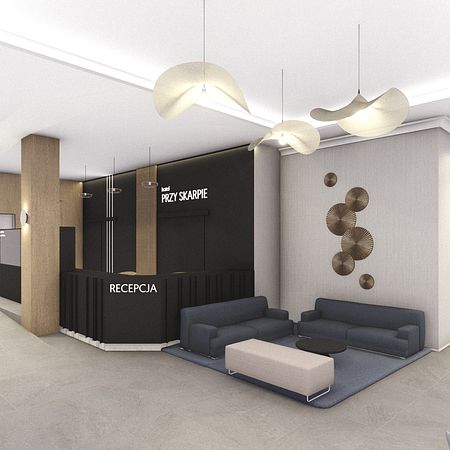 Recepcja hotelowa w stylu industrialnym i minimalistycznym z ciemnymi meblami.