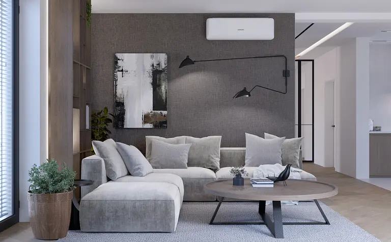 Wnętrze salonu z minimalistycznym wystrojem, szare ściany, nowoczesne meble.