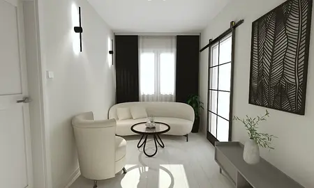 Salon z jasną sofą, drewnianym stołem i rośliną w doniczce.