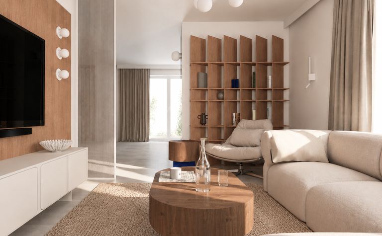 Wnętrze salonu w nowoczesnym stylu z miękkim minimalizmem, jasnymi meblami i drewnianymi detalami.