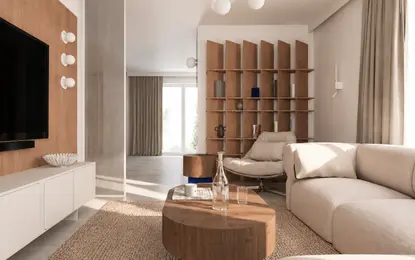Wnętrze salonu w nowoczesnym stylu z miękkim minimalizmem, jasnymi meblami i drewnianymi detalami.