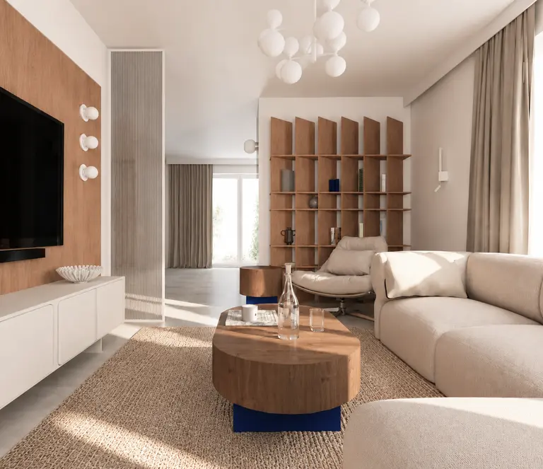 Wnętrze salonu w nowoczesnym stylu z miękkim minimalizmem, jasnymi meblami i drewnianymi detalami.