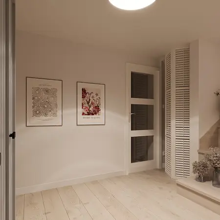 Minimalistyczny przedpokój z drewnianą podłogą i nowoczesnymi obrazami na ścianie.
