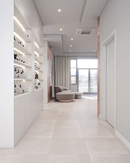 Przedpokój w minimalistycznym stylu z szarymi płytkami i białymi meblami.