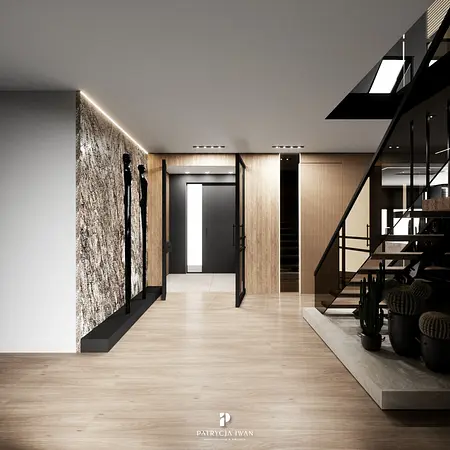 Przedpokój w stylu industrialnym z minimalistycznymi akcentami, drewnianą podłogą i roślinami.