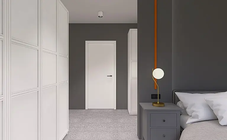 Garderoba w minimalistycznym stylu z białymi meblami i szarymi akcentami